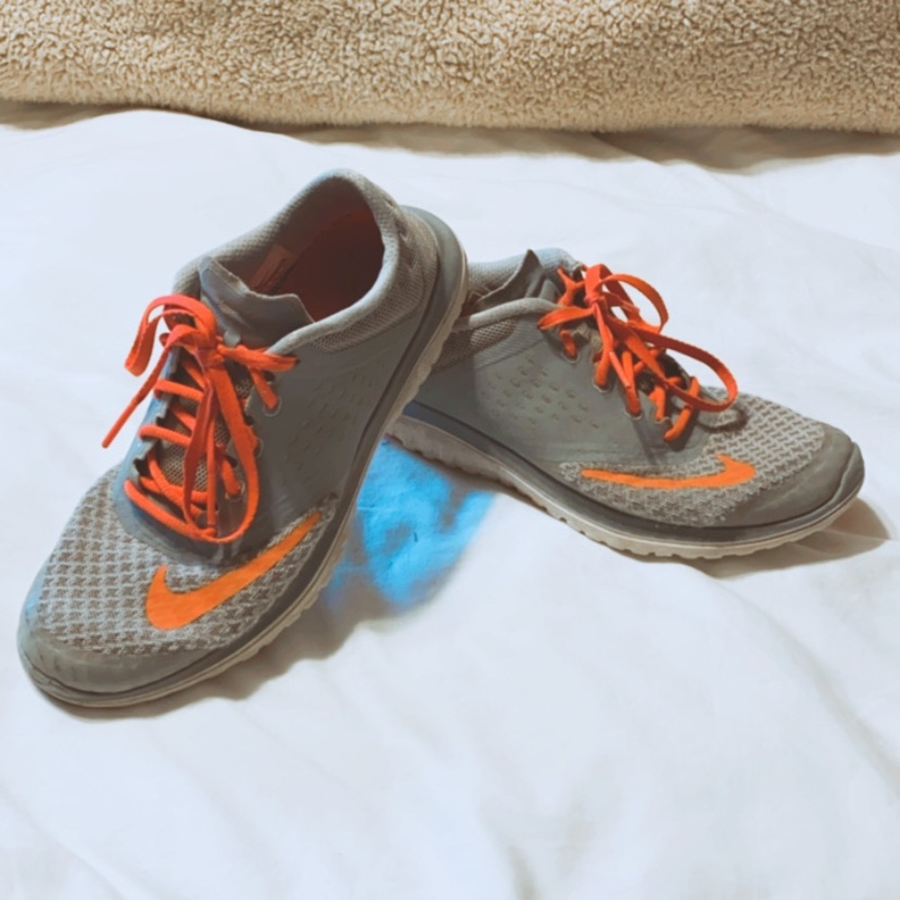 Pink and gray women’s Nike running shoes